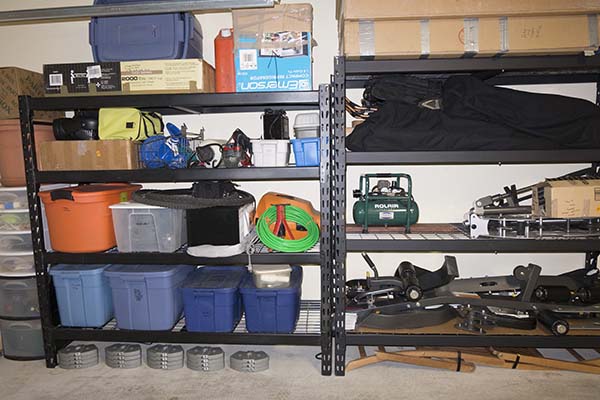 Photograph of Edsal and Husky brand steel garage shelving units, side by side.